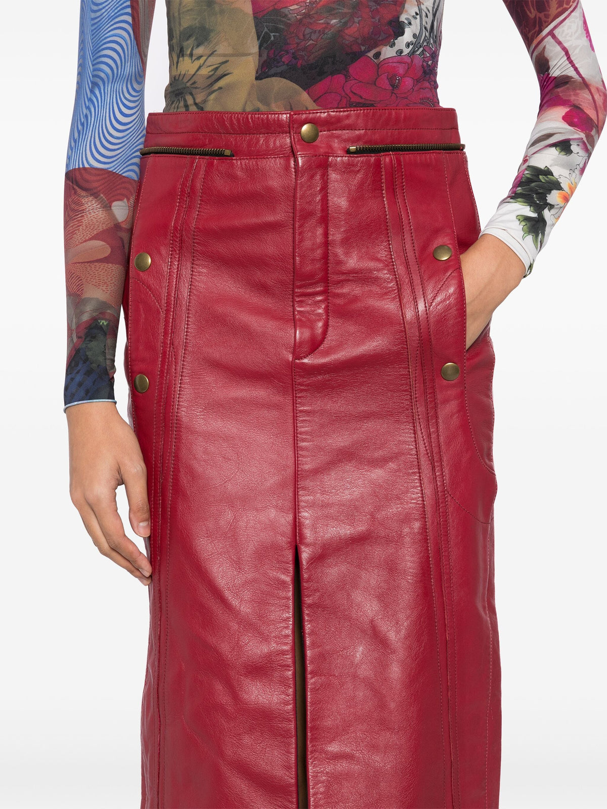 Chloé red leather pencil skirt with high waist and sleek fit, shown on a model in a fashion photoshoot.