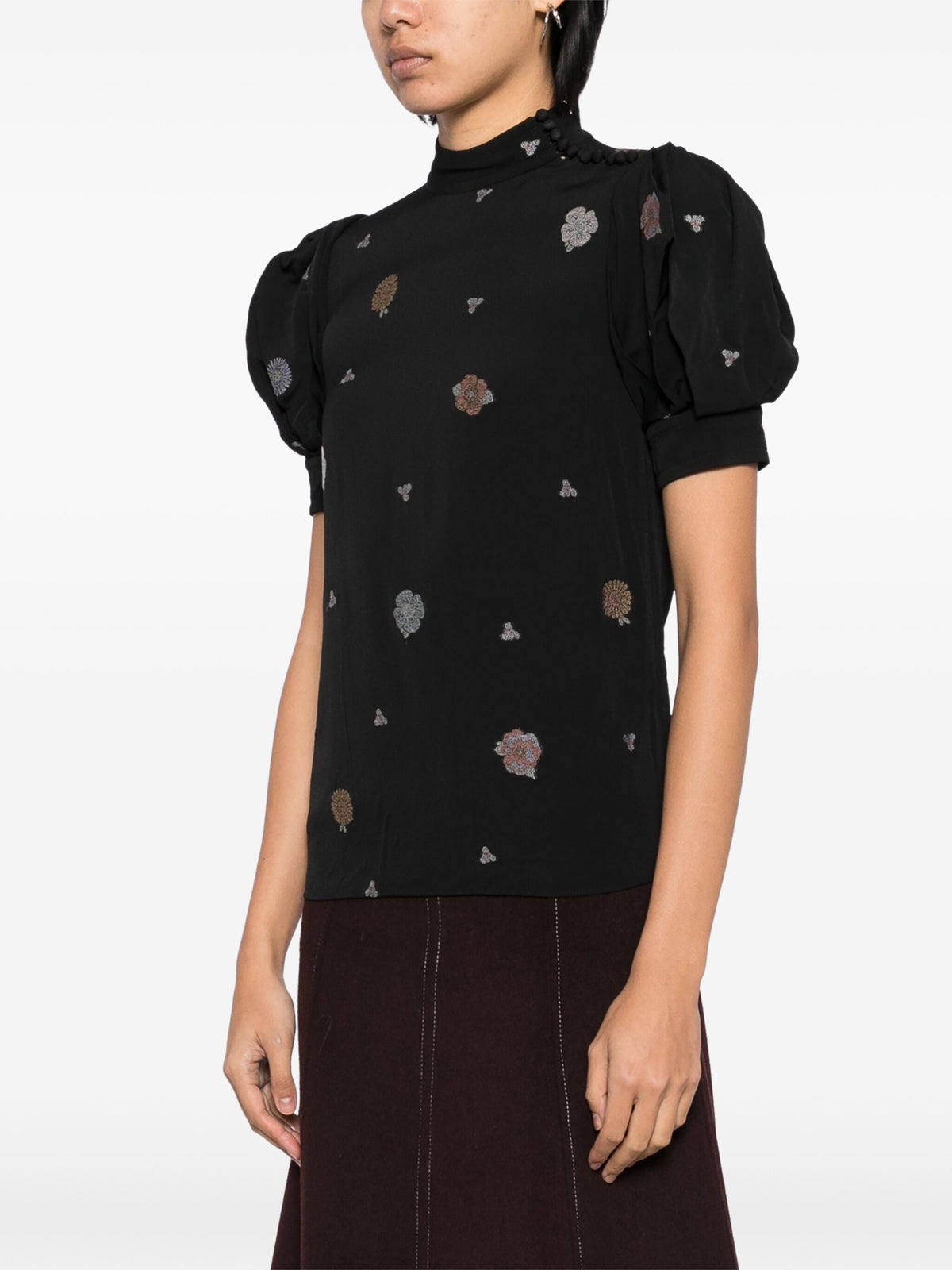 Black embroidered high-neck top from Chloé, featuring intricate embroidery and a stylish high neckline.