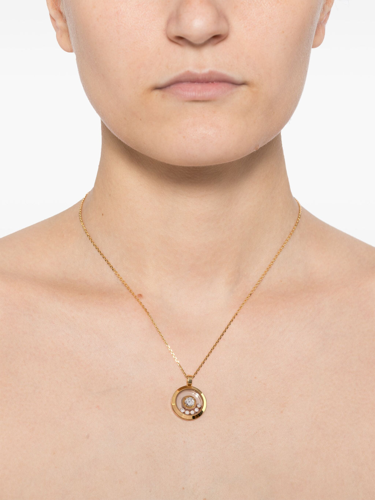 Chopard Happy Diamonds Icons Necklace featuring sparkling diamond accents and sleek gold chain in fine jewelry style.