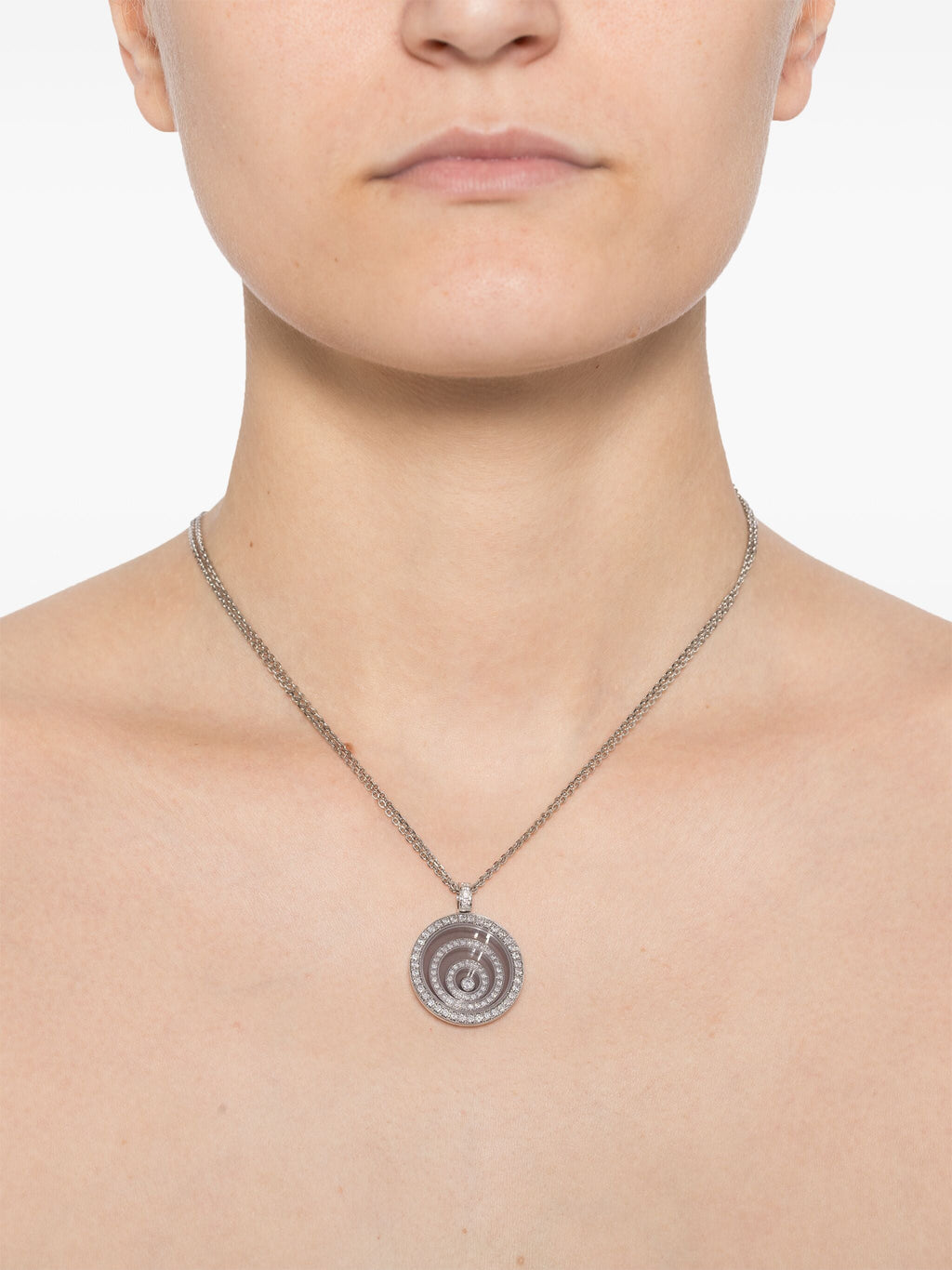 White diamond Happy Spirit necklace by Chopard, featuring a delicate fine jewelry pendant with sparkling diamonds on a silver chain.