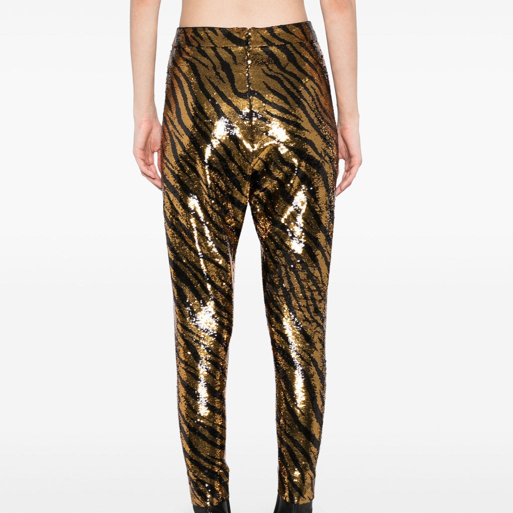 Balenciaga sequin stretch-jersey leggings featuring shiny sequins and a snug fit, styled as fashionable trousers.