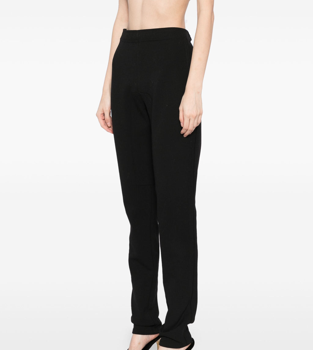 Hermès black riding trousers made of sleek fabric, featuring tailored fit and side pockets, designed for equestrian riding.