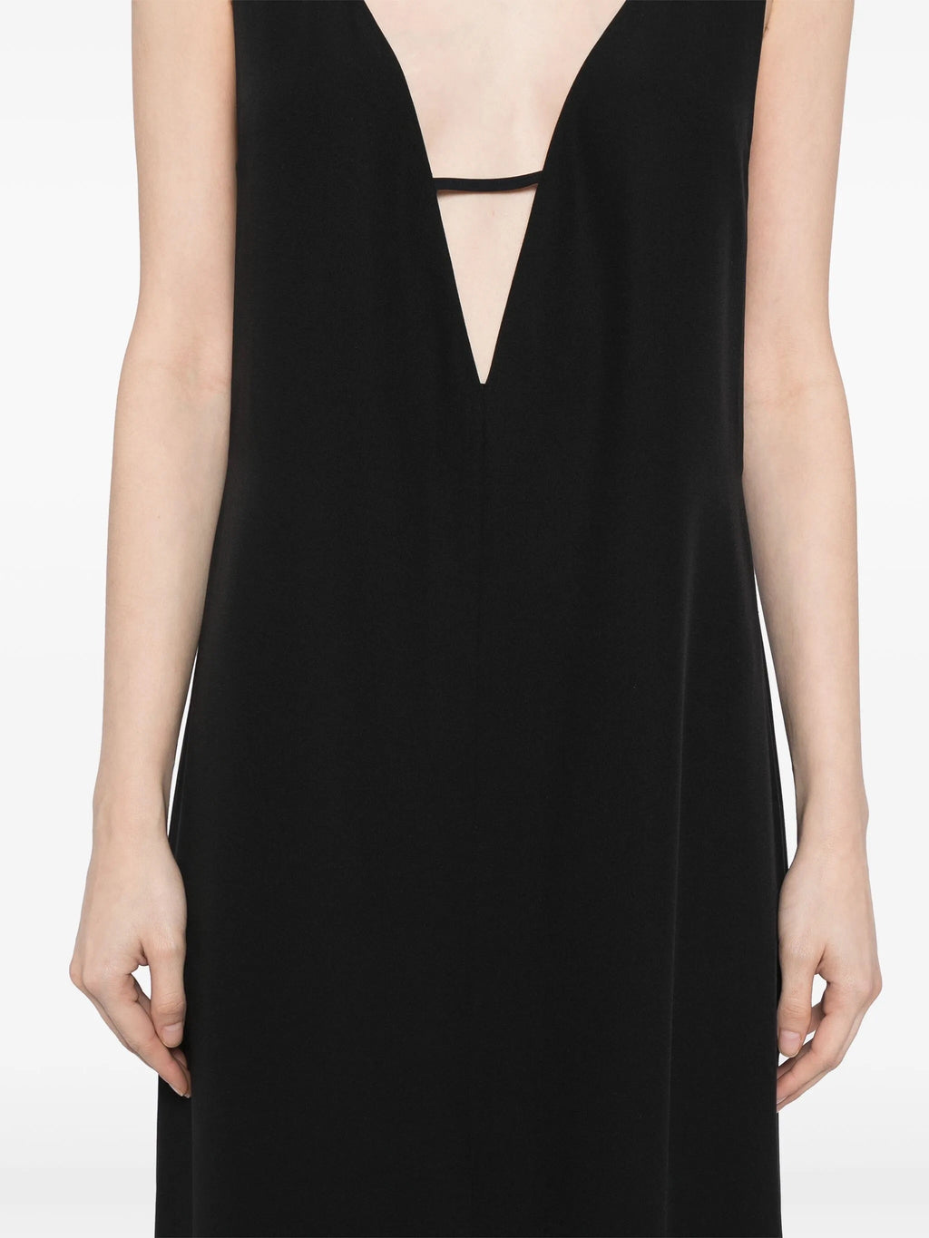 Deep V-neck slip dress by The Row, elegant black dress with a sleek, minimalist design and smooth fabric.