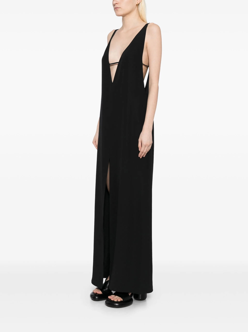Deep V-neck slip dress from The Row, elegant sleeveless dress with smooth fabric and minimalist design, perfect for stylish occasions.