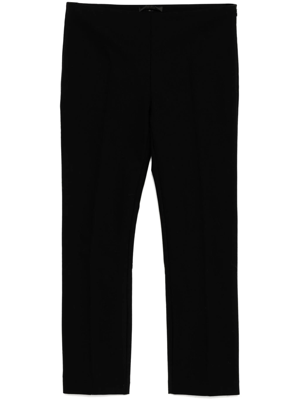 Tapered textured black trousers from The Row, featuring a modern fit and subtle fabric pattern.
