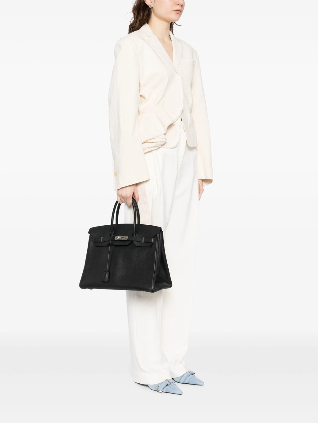 Hermès Birkin 35 Black Togo leather top handle bag with gold hardware, showcasing its elegant design and premium craftsmanship.