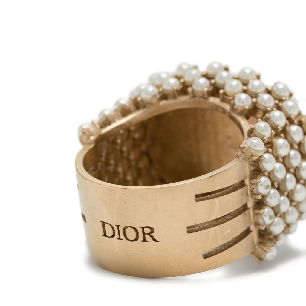 Dior ornate ring featuring pearls and intricate metalwork, elegant jewelry piece with a luxurious design.