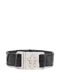 Fleur-de-Lis Pavé Buckle Leather Bracelet featuring decorative metal accents and a stylish buckle closure.