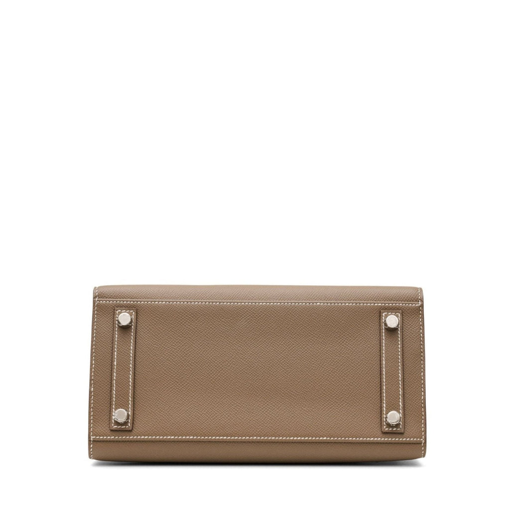 Hermès Birkin 25 Sellier top handle bag in Etoupe Epsom leather with gold hardware, showcasing its structured design and craftsmanship.