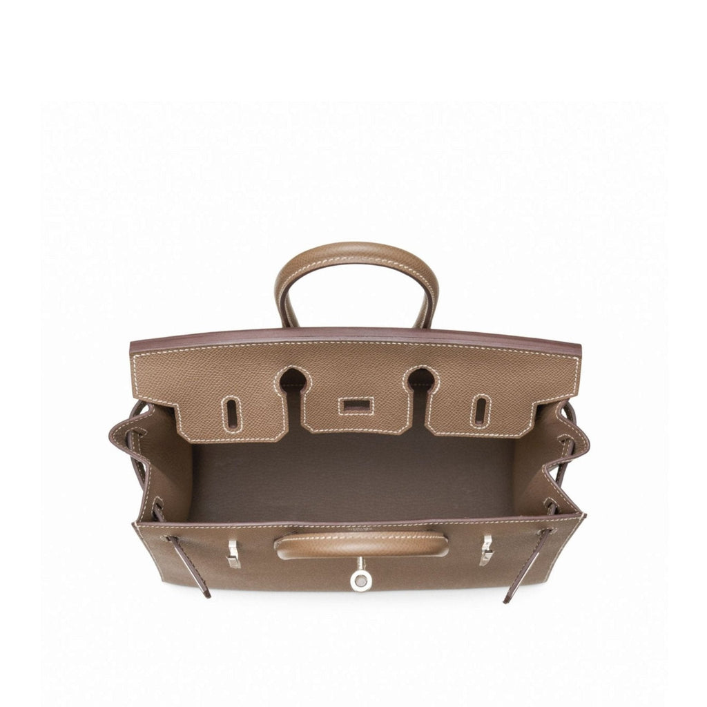 Hermès Birkin 25 Sellier top handle bag in Etoupe Epsom leather with palladium hardware, showcasing its structured design.