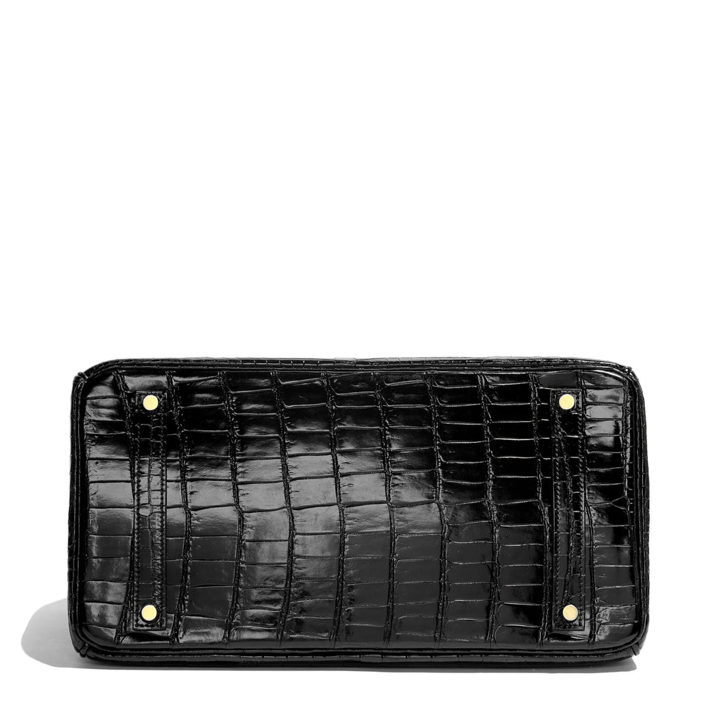 Hermès Birkin 35 black GHW top handle bag with gold hardware, showcasing its luxurious leather and elegant design.