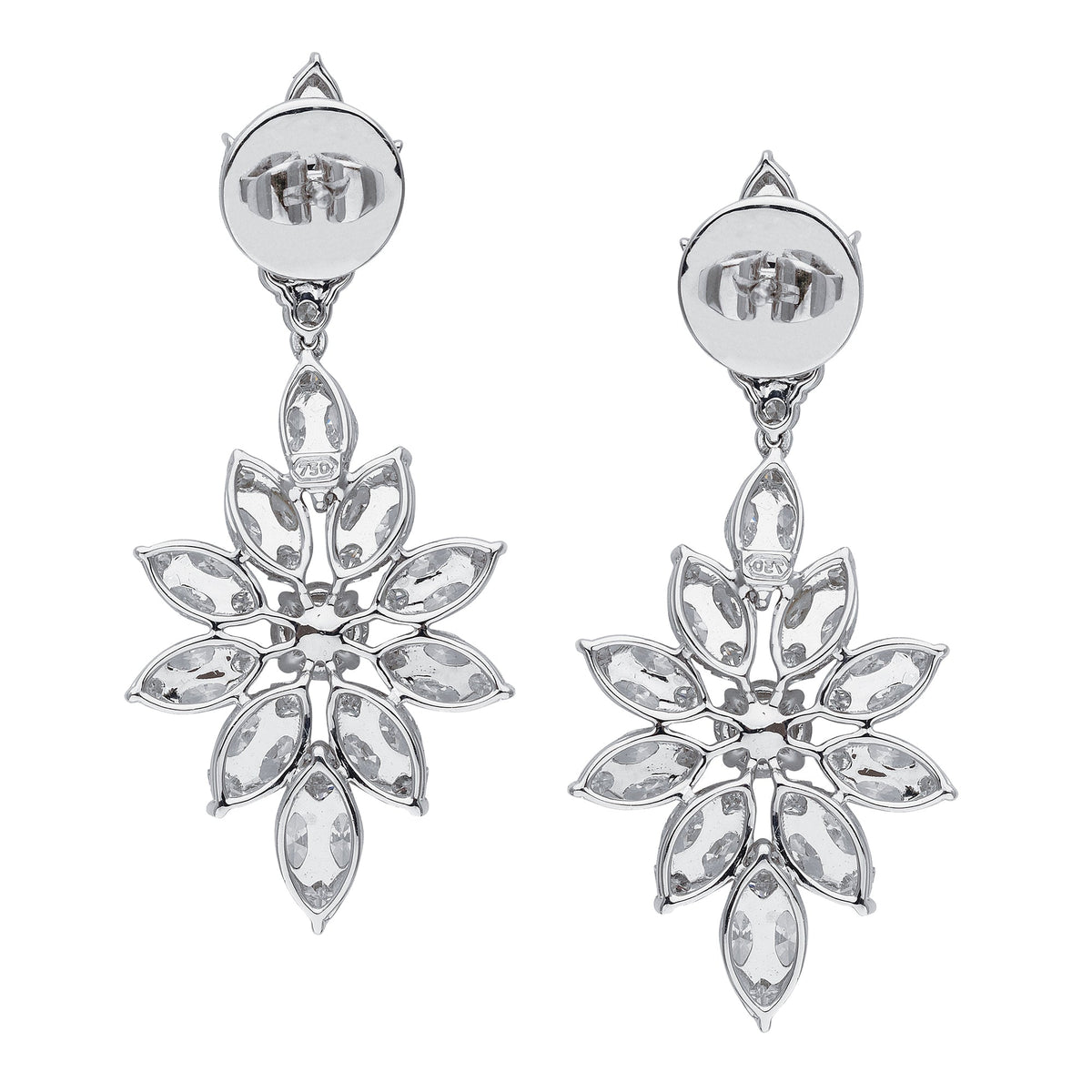 Korloff diamond earrings featuring sparkling gemstones set in elegant metal, showcasing luxury jewelry style.