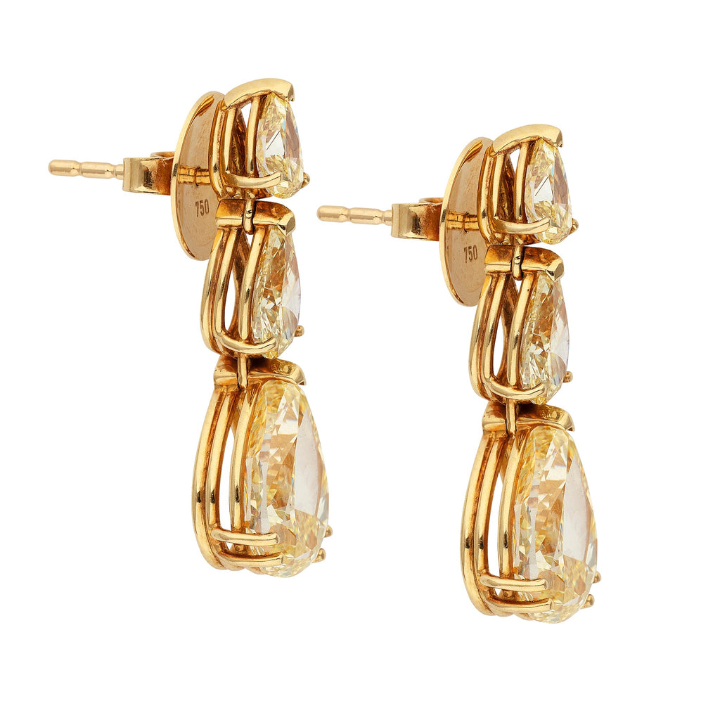 Bucherer fancy yellow diamond earrings featuring sparkling yellow diamonds set in elegant earrings design