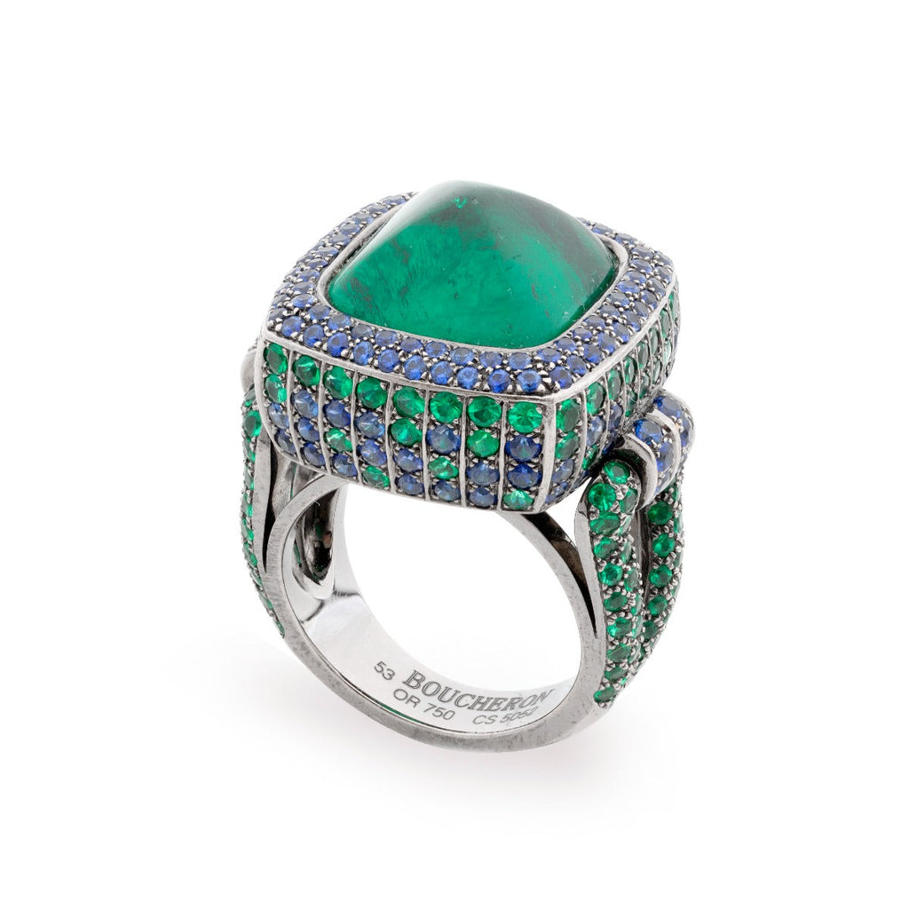 Boucheron 15kt emerald and sapphire ring featuring a gold band with vibrant green emerald and deep blue sapphire gemstones.