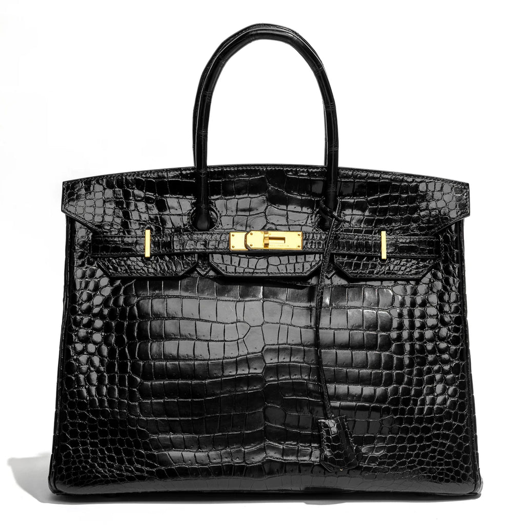 Hermès Birkin 35 Black GHW top handle bag with gold hardware, showcasing luxurious leather craftsmanship.