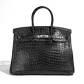 Hermès Birkin 35 grey leather top handle bag with gold hardware, stylish and luxurious accessory.
