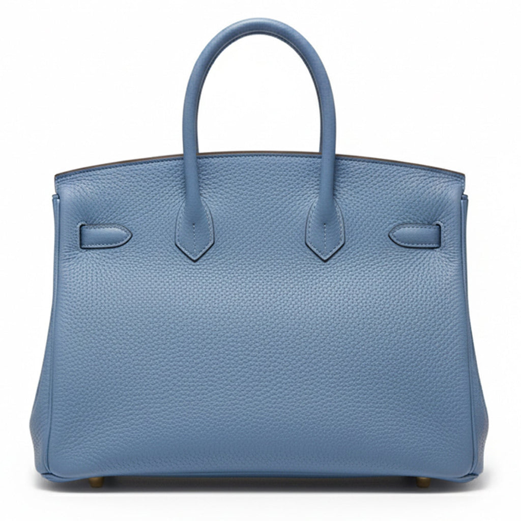 Hermès Birkin 35 Blue PHW top handle bag with structured design and gold hardware, shown from the back.