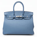 Hermès Birkin 35 Blue PHW top handle bag showing front view with structured leather and gold hardware.