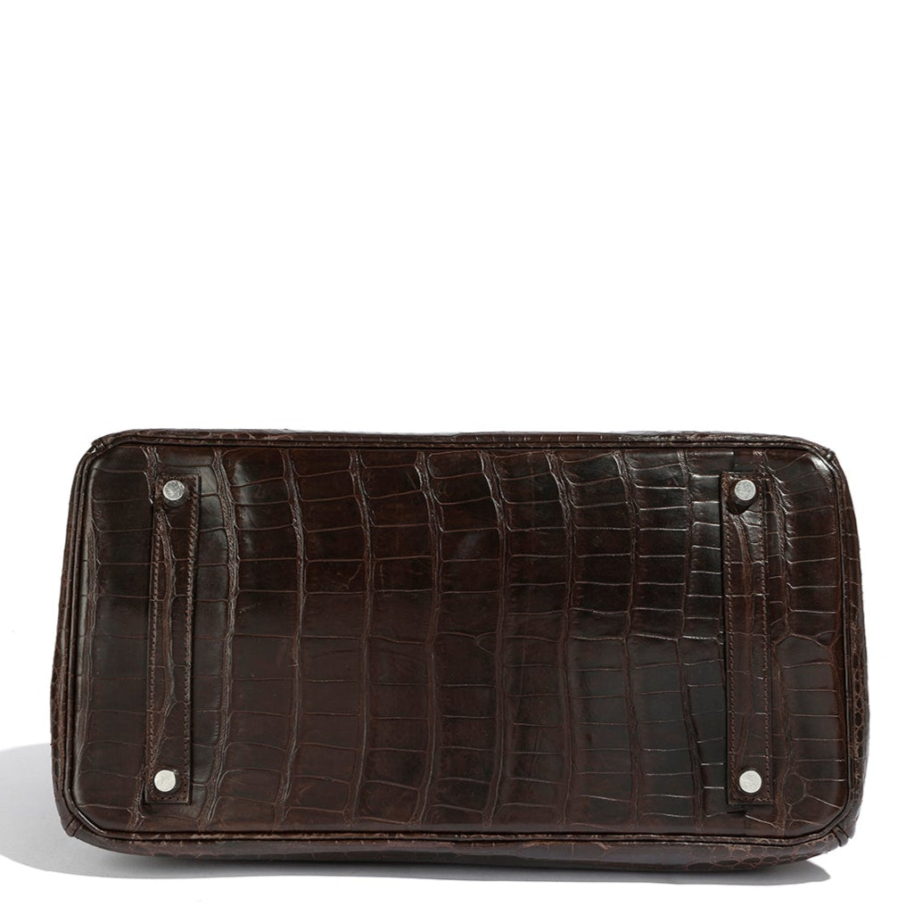 Hermès Birkin 35 Marron top handle bag with gold hardware, showcasing its luxurious leather and elegant design.