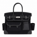 Hermès Birkin 35 Cargo Noir toile and Swift leather top handle bag with gold hardware, showcasing its elegant design.