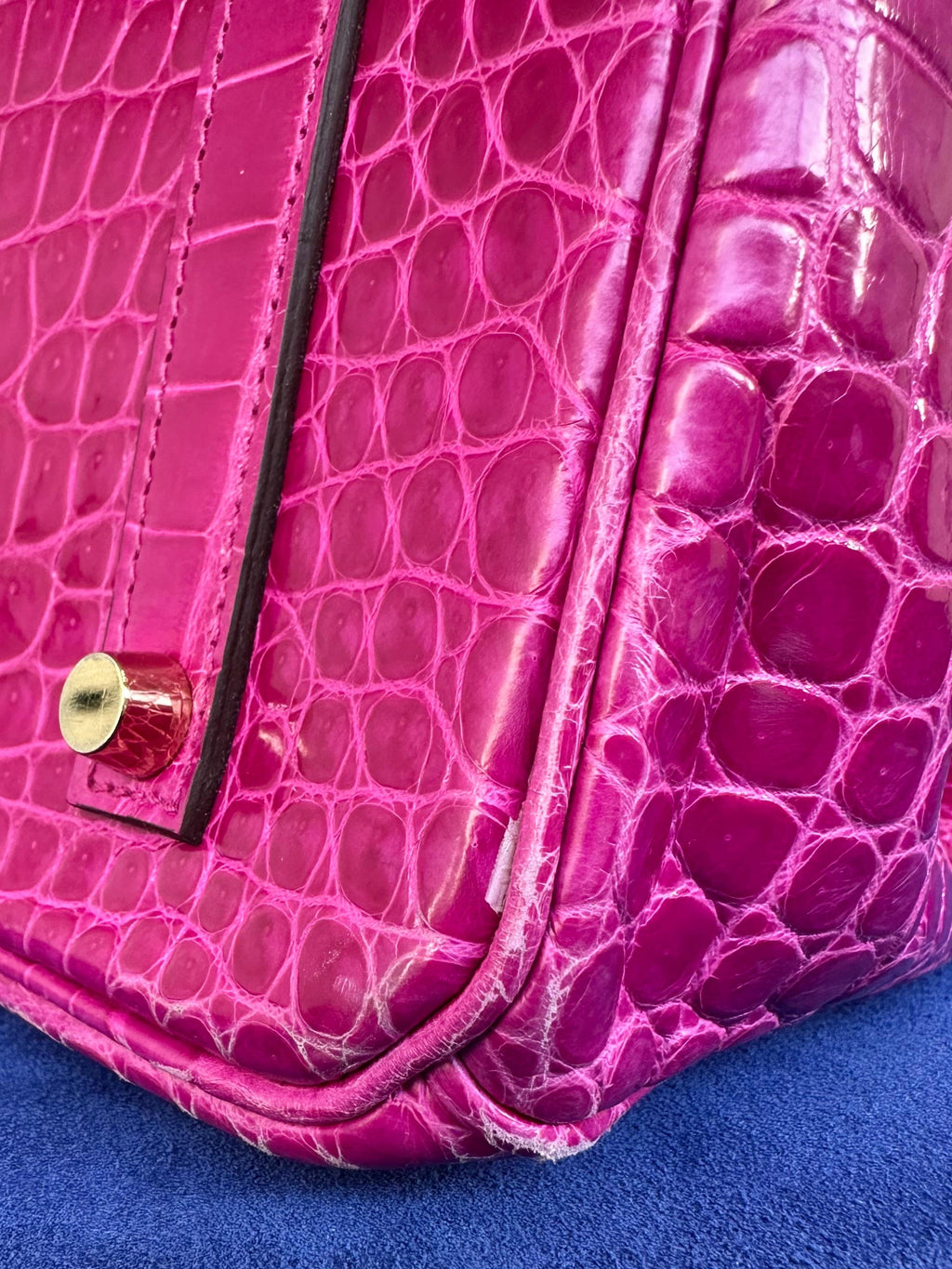 Hermès Birkin 35 Rose Sheherazade GHW top handle bag showing corner with gold hardware and luxurious pink leather finish.