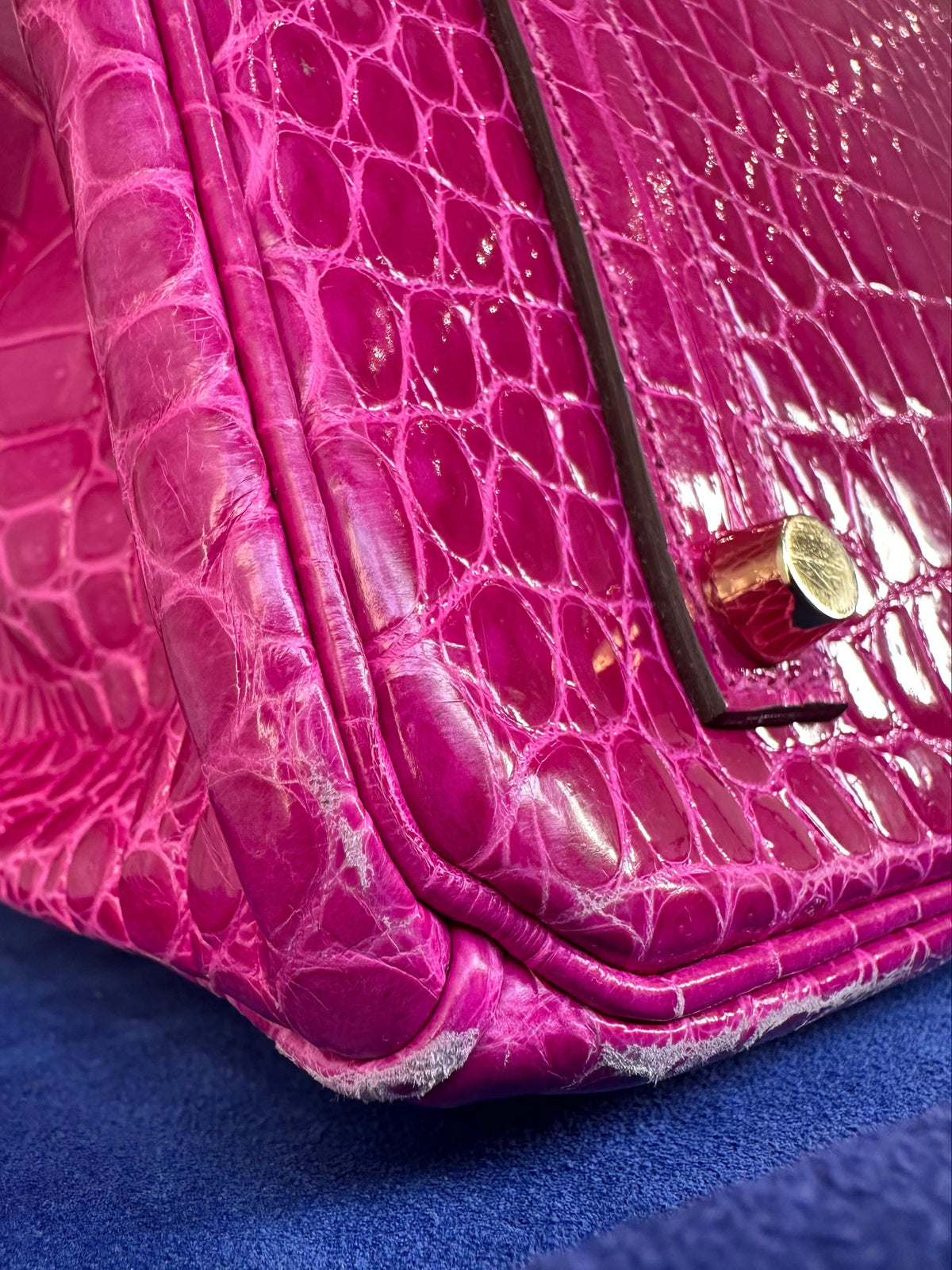 Hermès Birkin 35 Rose Sheherazade GHW top handle bag, showing corner view with rose pink leather and gold hardware details.