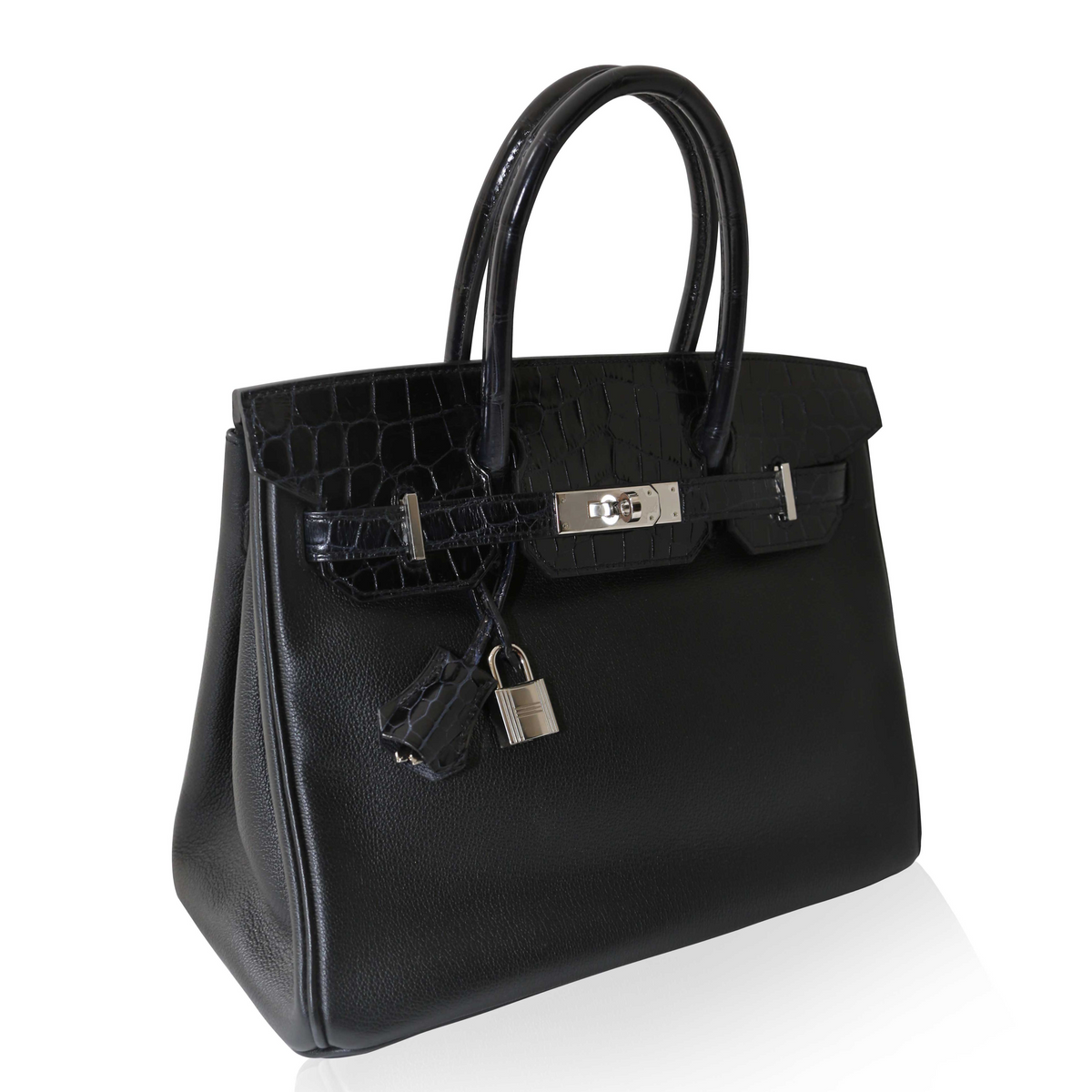 Hermès Touch Birkin 30 top handle bag in luxurious leather with gold hardware, featuring distinctive design and elegant craftsmanship.