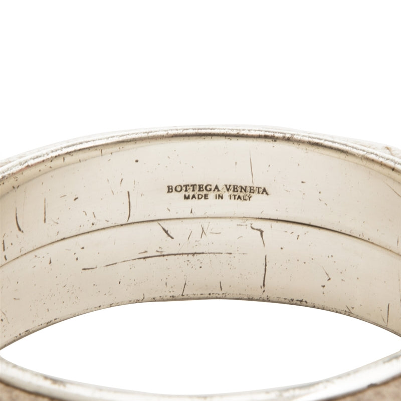 Bottega Veneta cuff bracelet with sleek leather design and minimalist style, showcasing luxurious craftsmanship.
