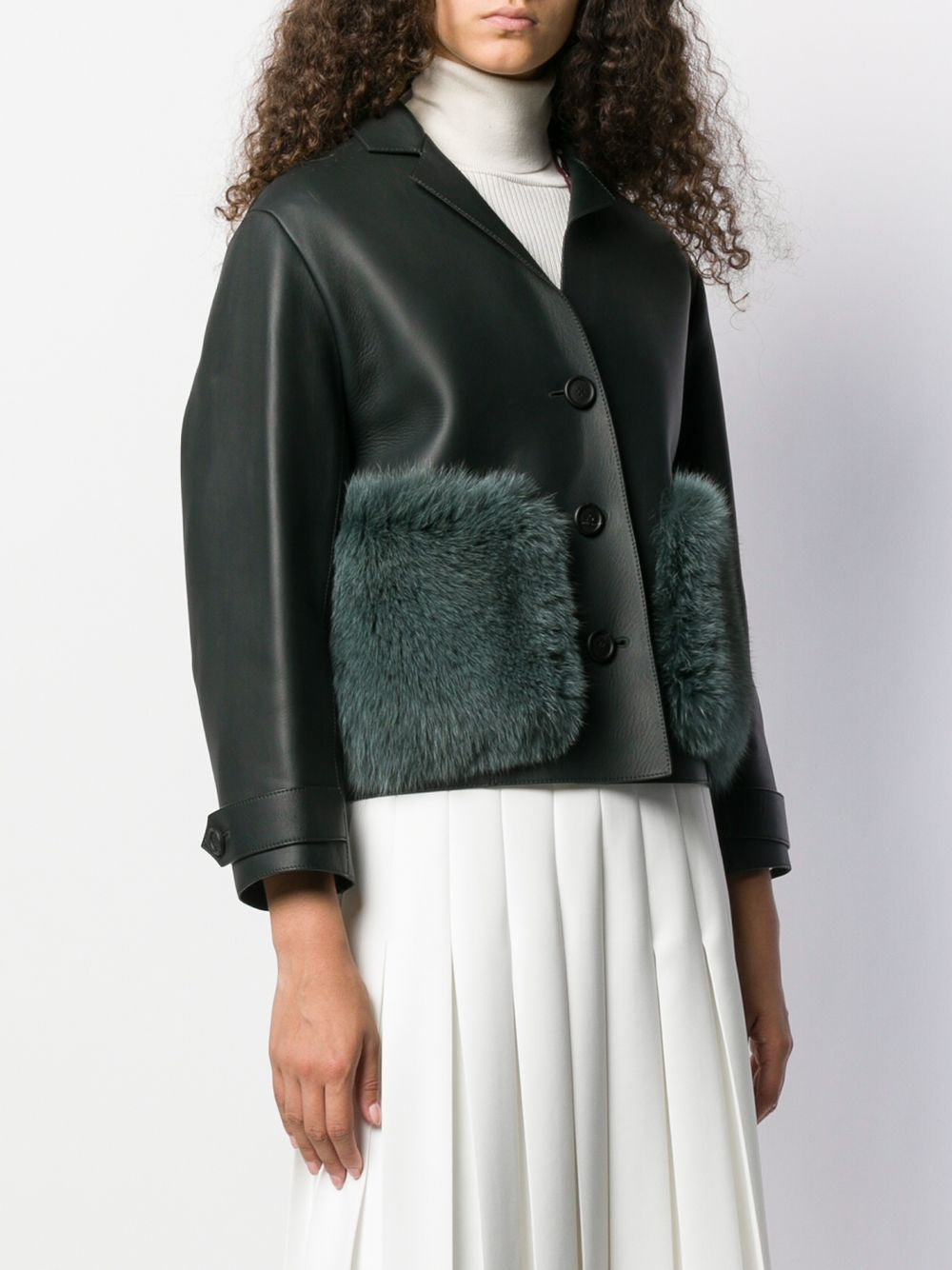 Black leather coat with fur trim from Prorsum, featuring sleek design and tailored fit, ideal for stylish winter wear.