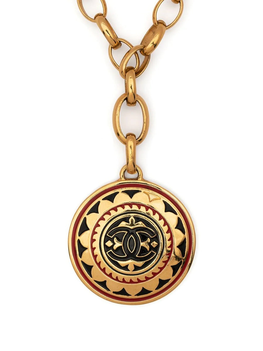 Chanel 1989 CC medallion necklace with gold-tone chain and prominent CC logo pendant, stylish jewelry accessory.