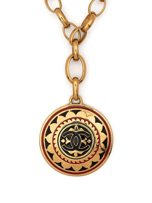 Chanel 1989 CC medallion necklace with gold-tone chain and prominent CC logo pendant, stylish jewelry accessory.
