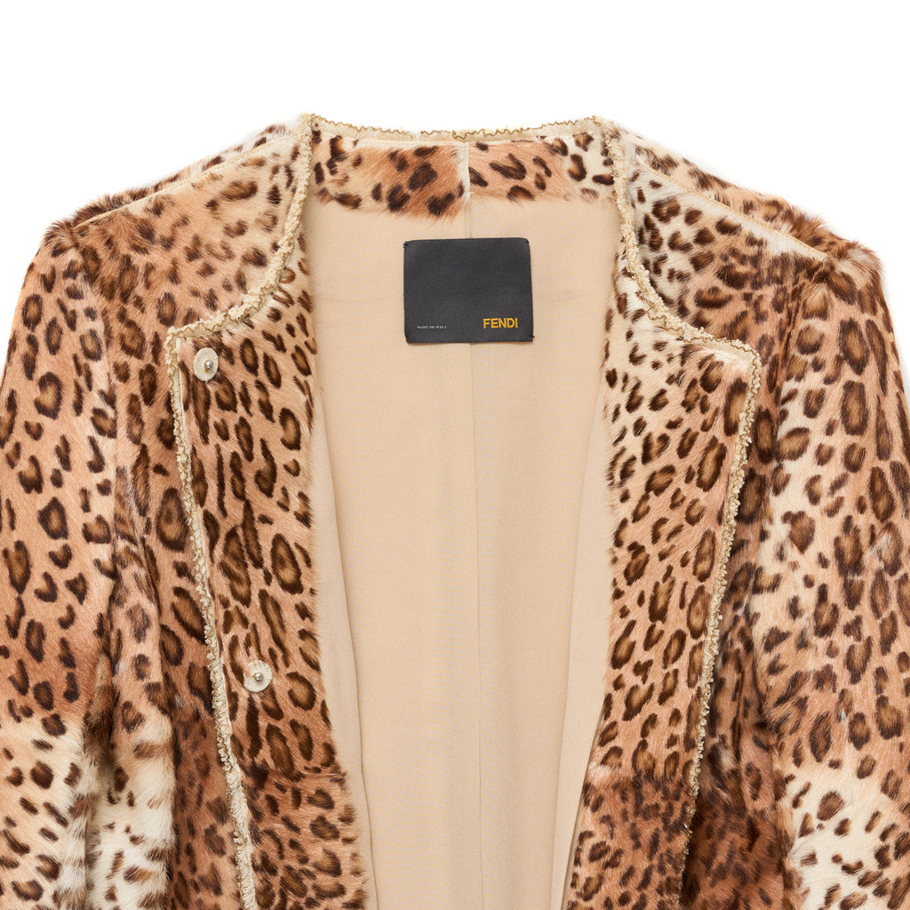 Fendi leopard print coat displayed on a hanger, showcasing its stylish animal pattern and classic coat silhouette.