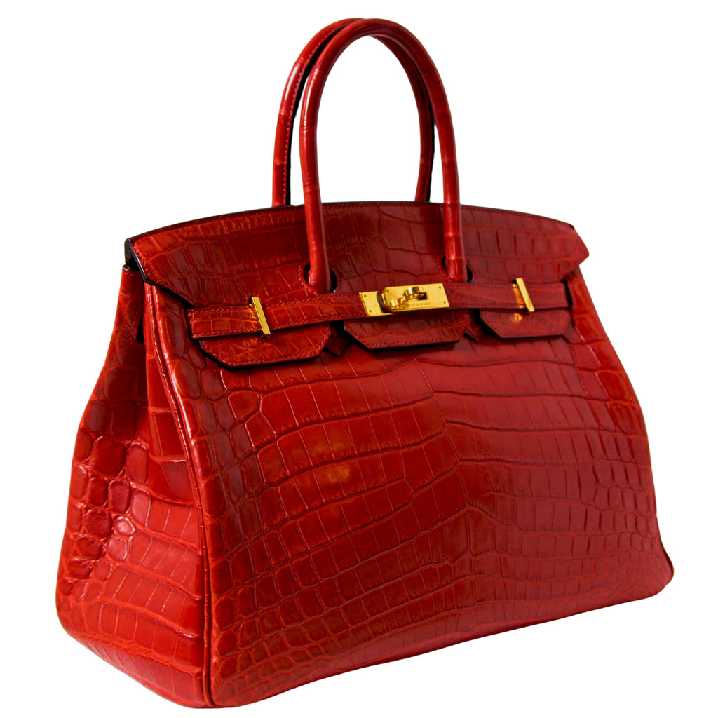 Hermès Birkin 35 Red GHW top handle bag shown from the side, featuring luxurious leather and gold hardware details.