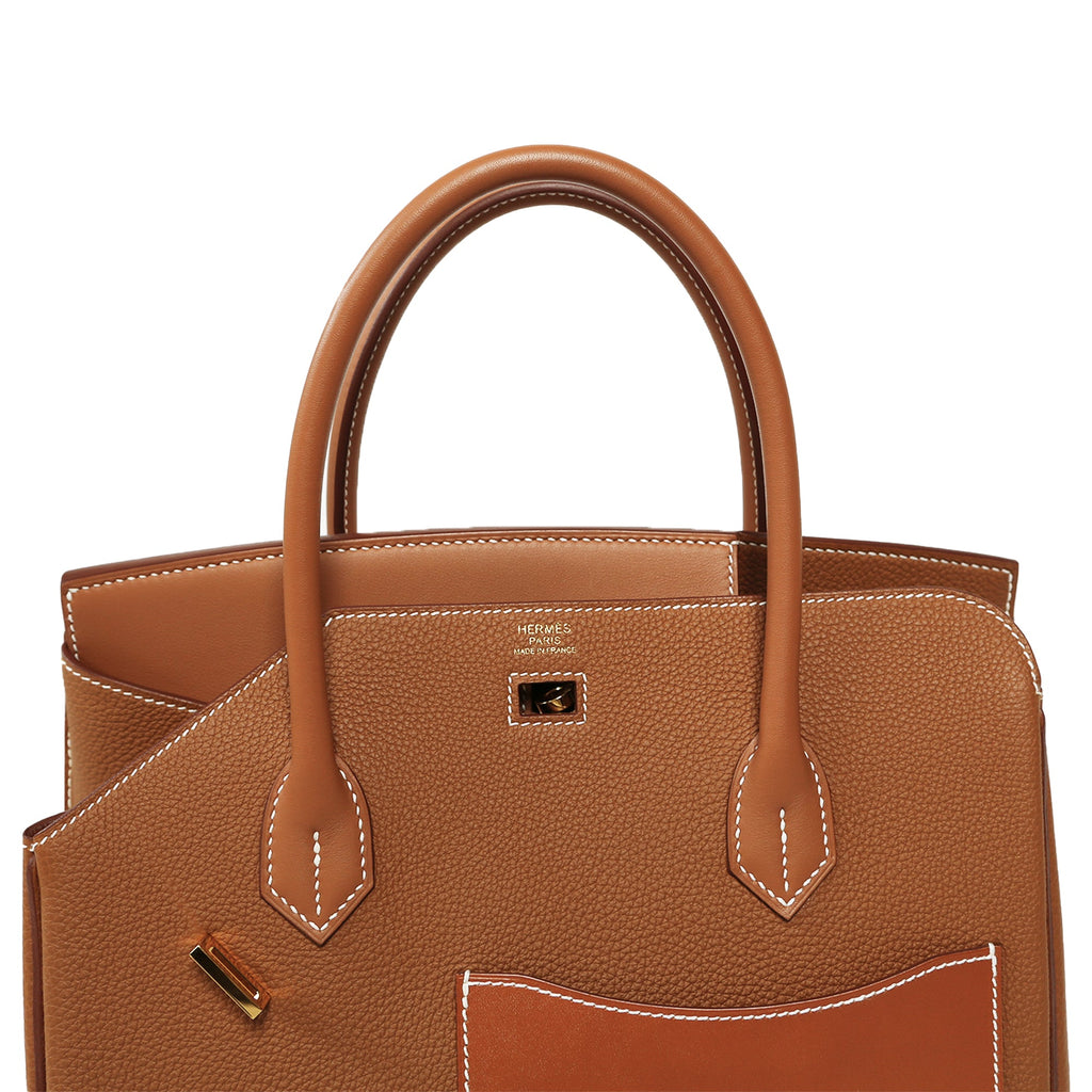 Hermès Birkin 30 Top Handle Bag in Desordre Gold with gold hardware, close-up of luxurious leather and detailed craftsmanship.