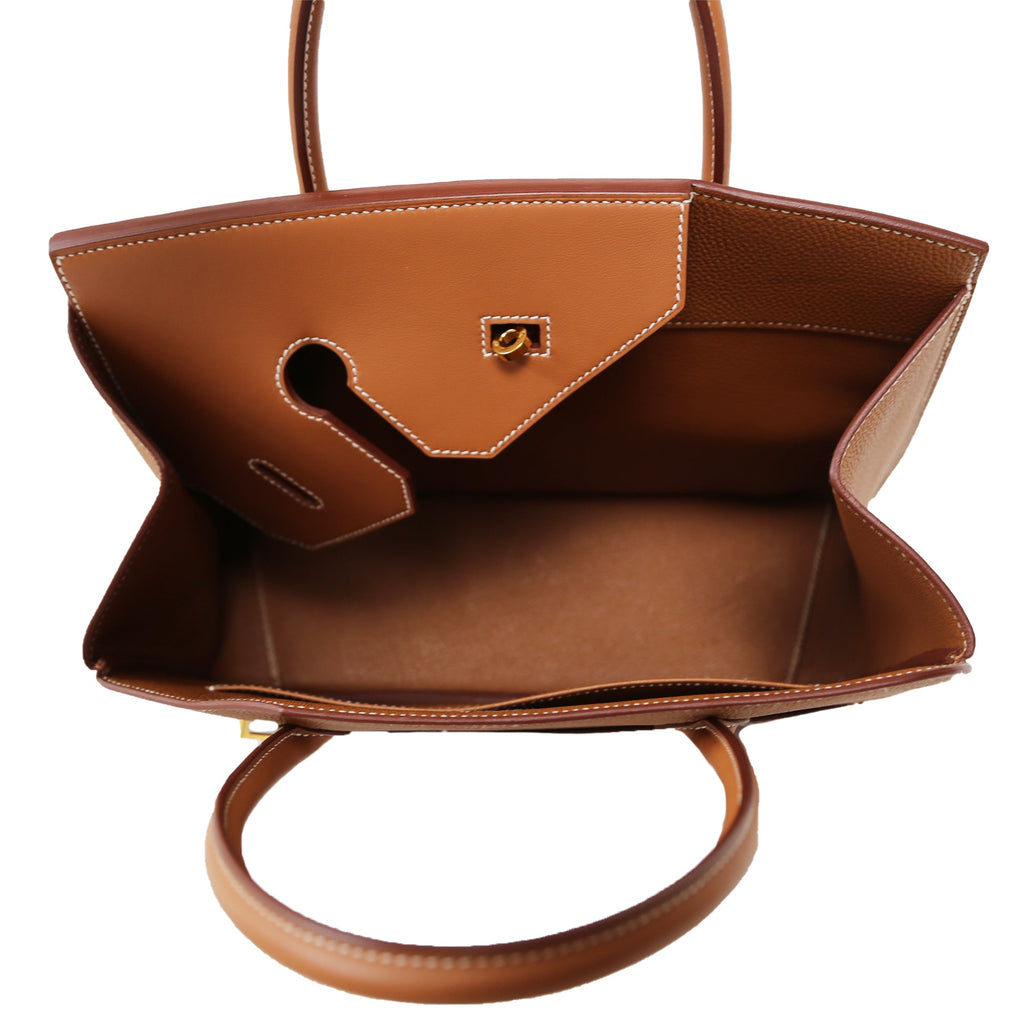 Inside view of the Hermès Birkin 30 Desordre Gold GHW top handle bag with leather interior and gold hardware.