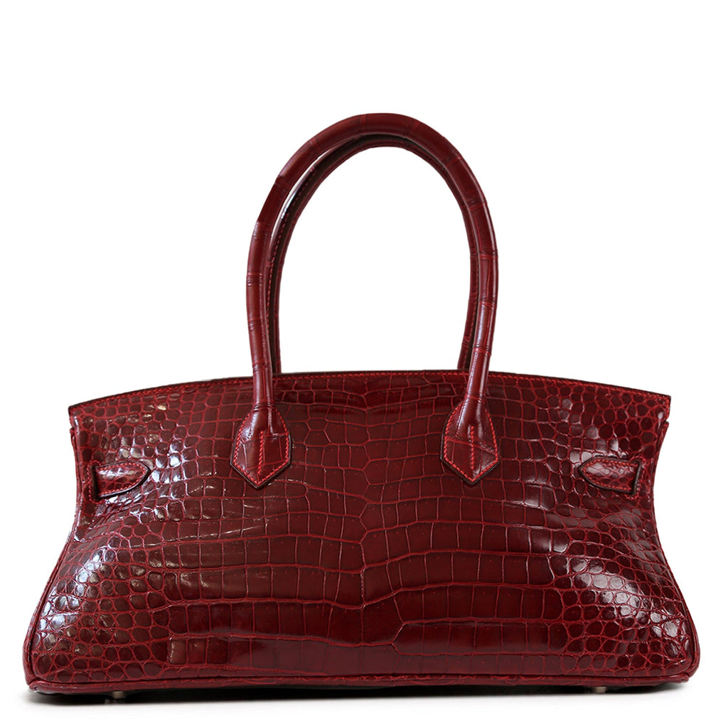 Hermès JPG Shoulder Birkin 42 Red Porosus PHW leather shoulder bag, shown from the back with sleek design and rich red color.