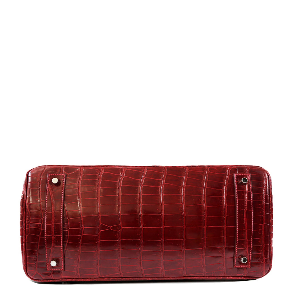 Hermès JPG Shoulder Birkin 42 Red Porosus PHW leather shoulder bag with gold hardware, shown from the bottom view.