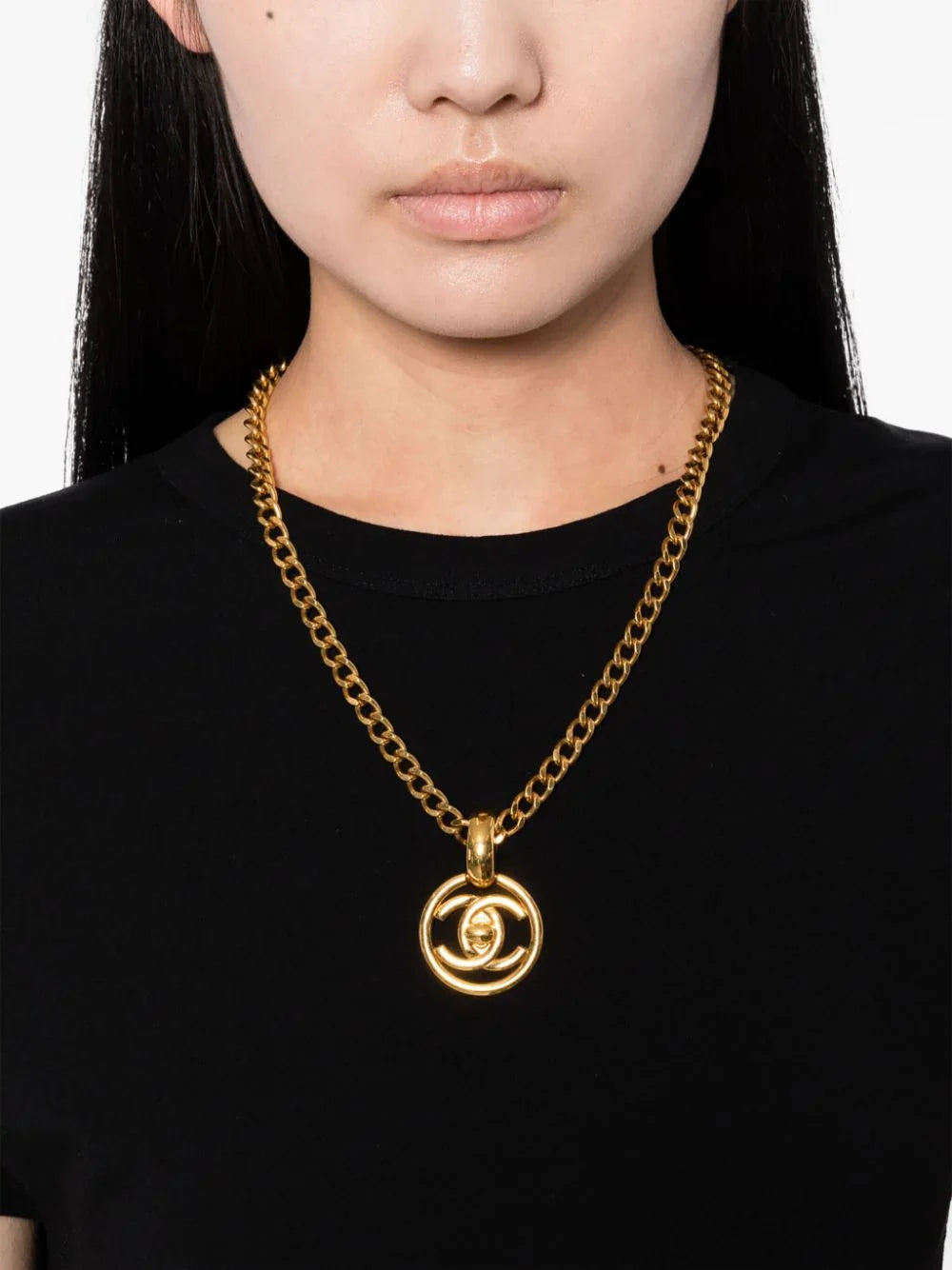 Chanel 1997 CC Turnlock pendant chain necklace with gold-tone finish and signature logo detail, stylish jewelry accessory.
