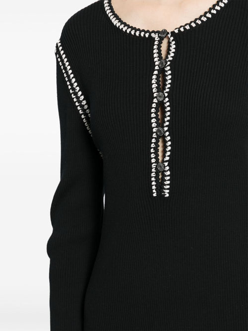 Black Chanel 2002 cotton mini dress with ribbed fabric, stylish and fitted, perfect for casual or chic occasions.