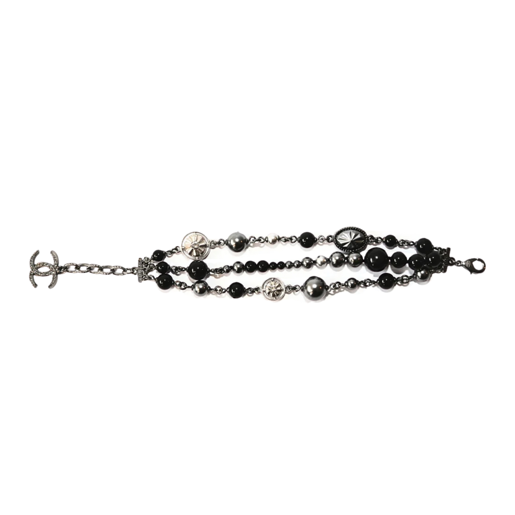 Chanel CC charm beaded bracelet featuring colorful beads and signature logo charms on a delicate chain.