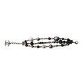 Chanel CC charm beaded bracelet featuring colorful beads and signature logo charms on a delicate chain.
