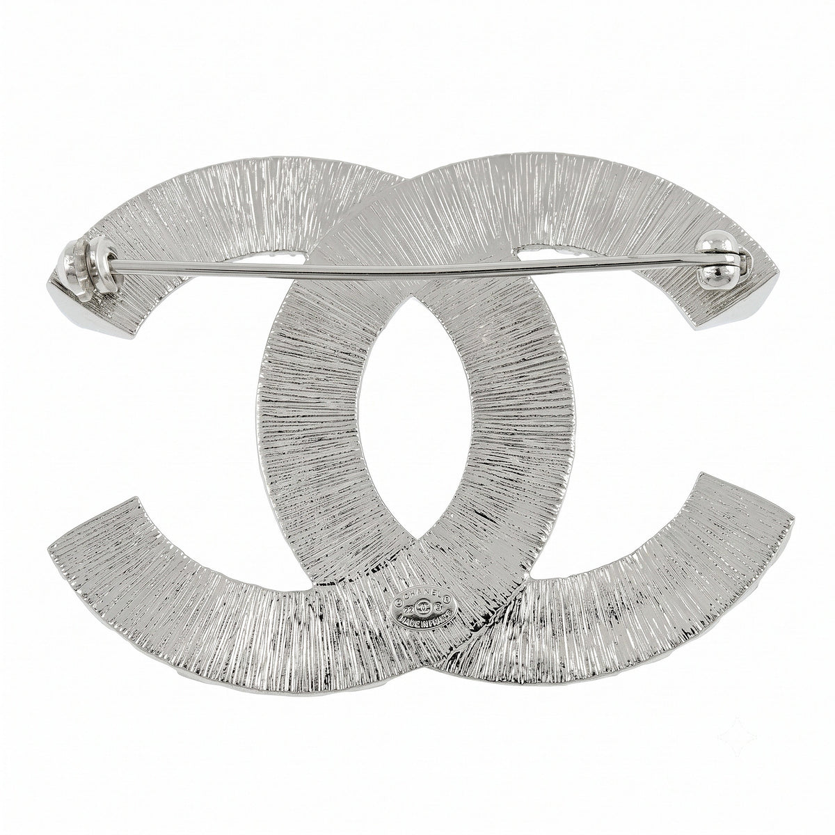 Chanel crystal pin brooch with sparkling detailing and elegant design, shown from the back with pin fastening.