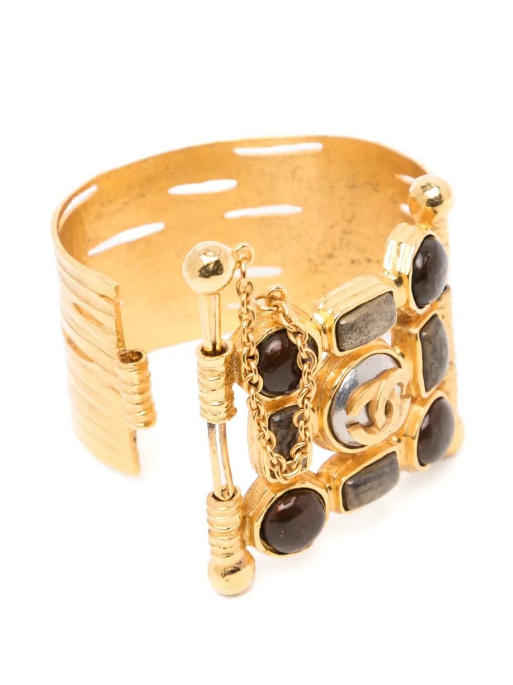 Gold Gripoix cuff bracelet from Chanel featuring intricate glass pebble details and a luxurious, stylish design.