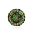 Green tweed Chanel ring featuring a stylish design, showcasing the textured fabric and elegant craftsmanship.