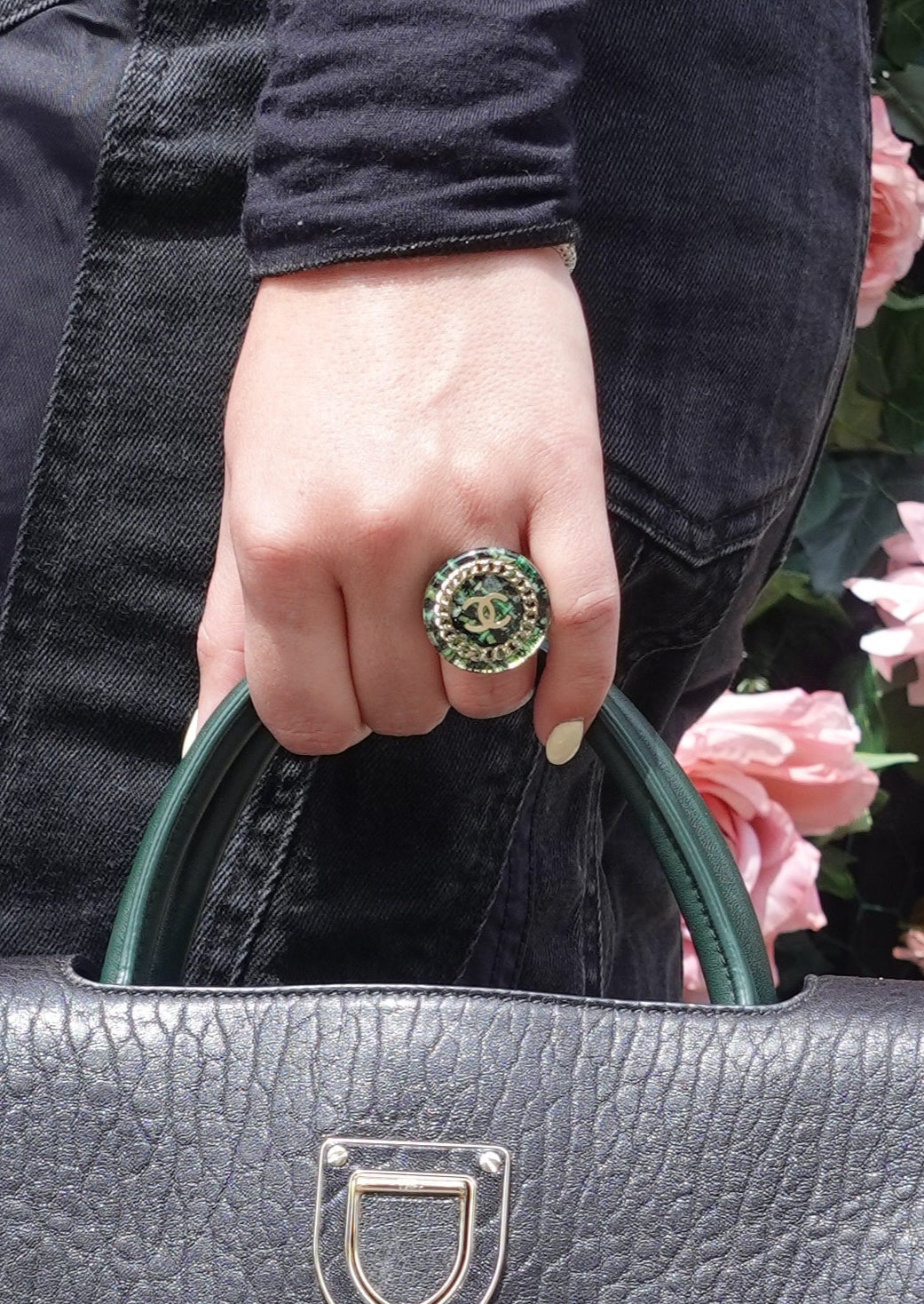 Chanel green tweed ring featuring a textured design and silver-tone band, stylish jewelry accessory for women.
