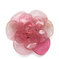 Pink Camellia brooch by Chanel featuring a delicate floral design and elegant craftsmanship.
