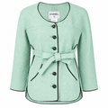 Mint green tweed Chanel jacket with belted waist, classic blazer style, and textured fabric from the 2012 spring collection.