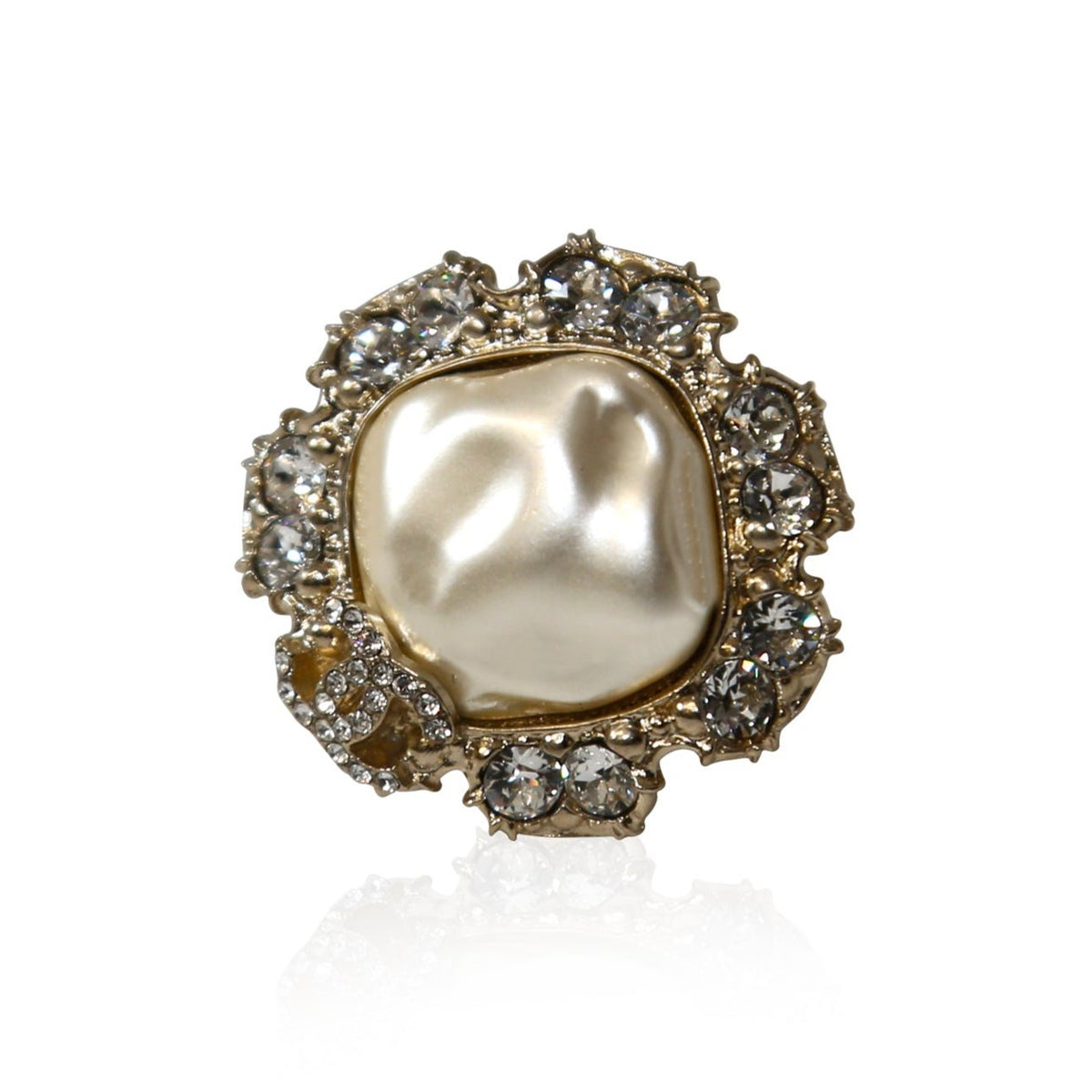 White Chanel CC ring with rhinestones, featuring a classic pearl design and sparkling accents, elegant jewelry accessory.
