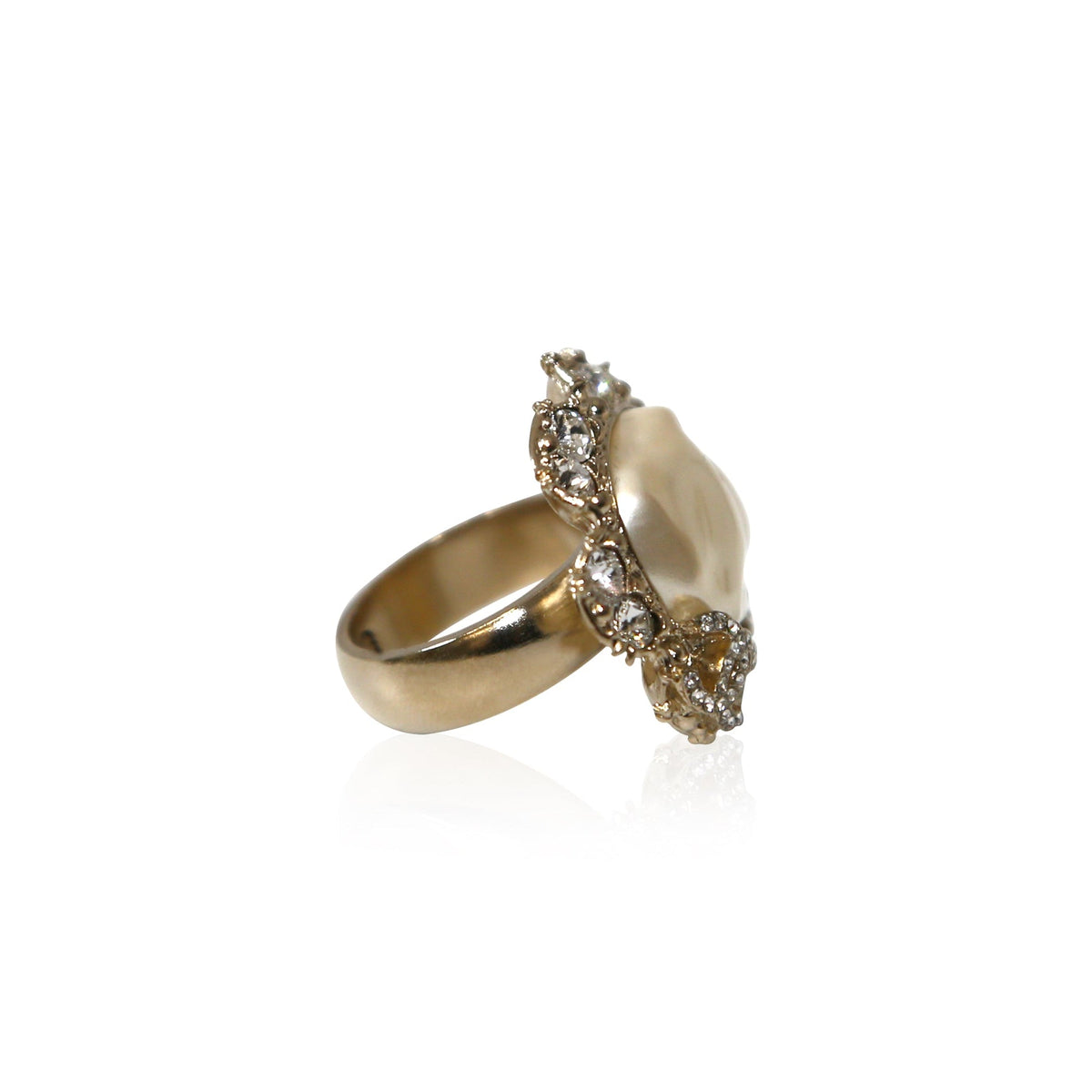 White Chanel CC ring with rhinestones, detailed close-up showing the elegant design and sparkling embellishments.