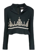 Black Chanel blazer with rhinestone embellishments, tailored fit, and elegant lapel, perfect for stylish formal occasions.